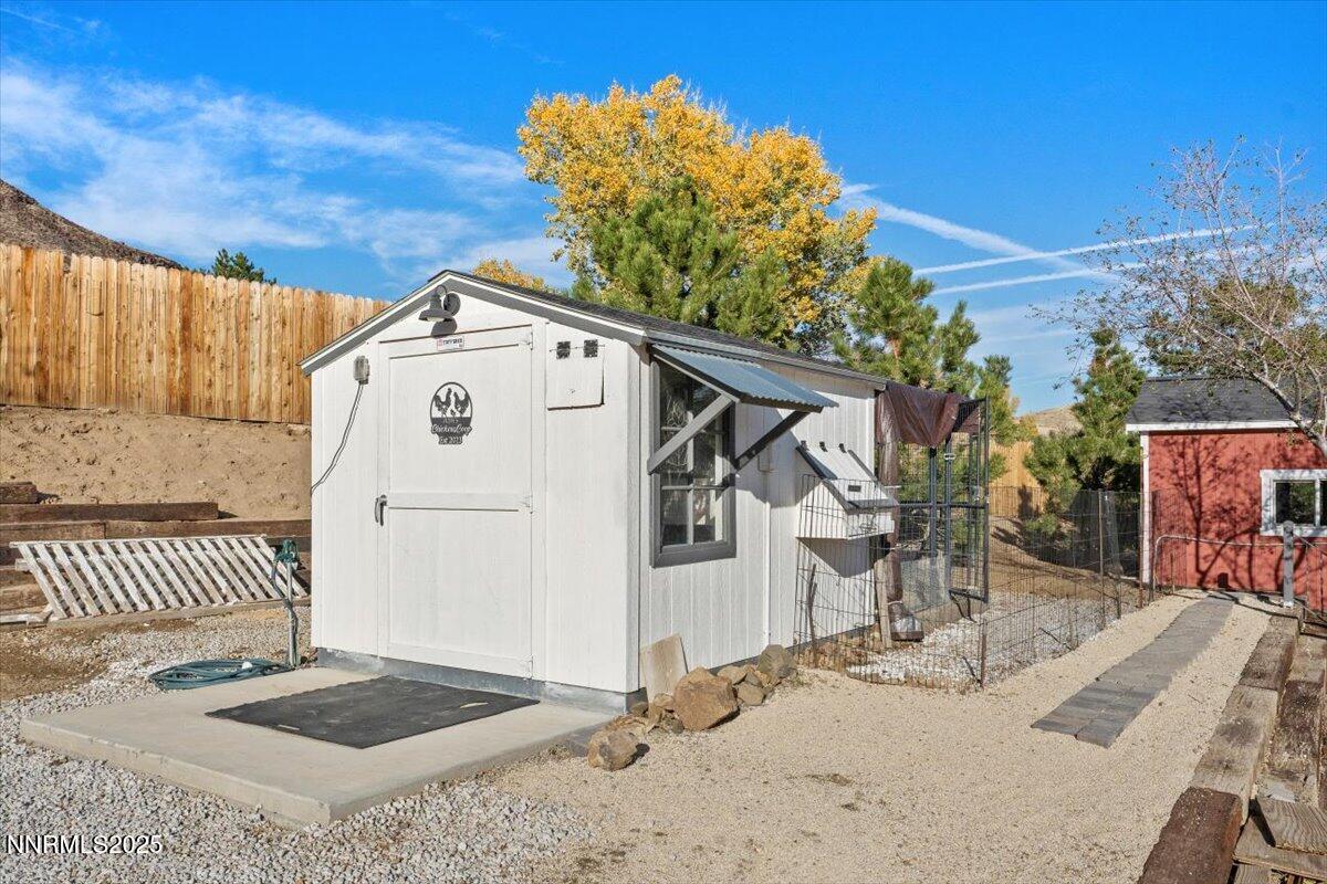 20855 Ames Lane Reno, NV 89521 - Photo 58 of 66 a front view of a house with a yard