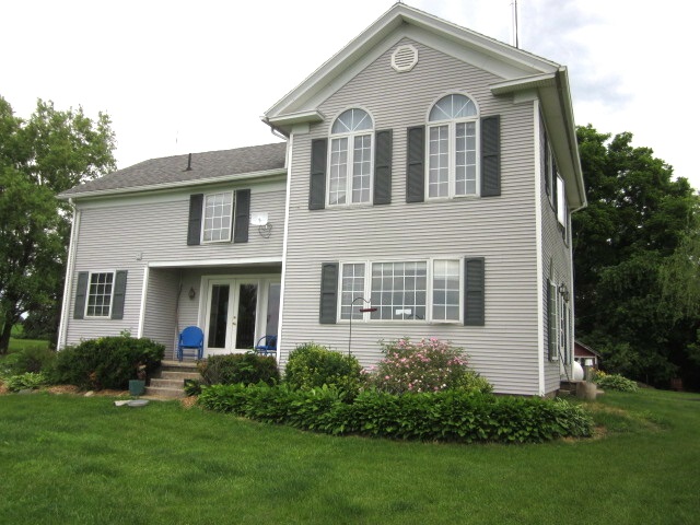 16169 Anderson Road Durand, IL 61024 - Photo 1 of 25 a front view of a house with a yard