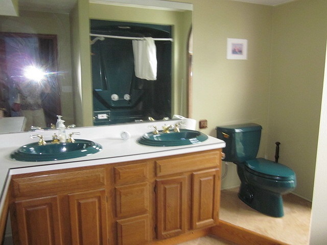 16169 Anderson Road Durand, IL 61024 - Photo 14 of 25 a bathroom with a sink and a mirror