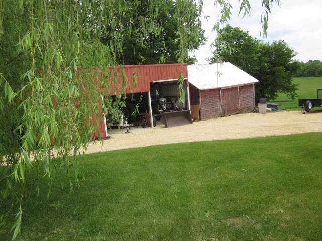 16169 Anderson Road Durand, IL 61024 - Photo 20 of 25 a backyard of a house with table and chairs