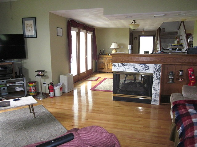 16169 Anderson Road Durand, IL 61024 - Photo 5 of 25 a living room with furniture and a fireplace