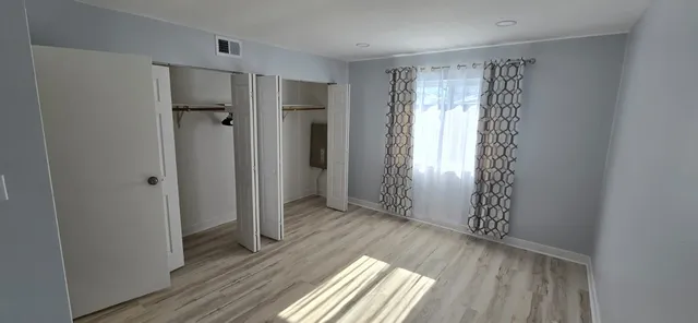 a view of entryway with wooden floor