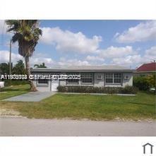 a backyard with a garden and entertaining space