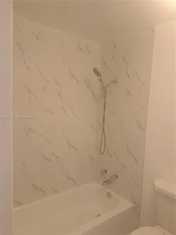 a close up of a bathtub curtain