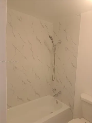 a close up of a bathtub curtain