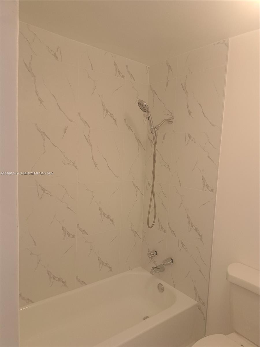 17 Northeast 2nd Road, Unit B Homestead, FL 33030 - Photo 5 of 8 a close up of a bathtub curtain