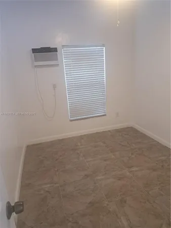 an empty room with an empty space and a window