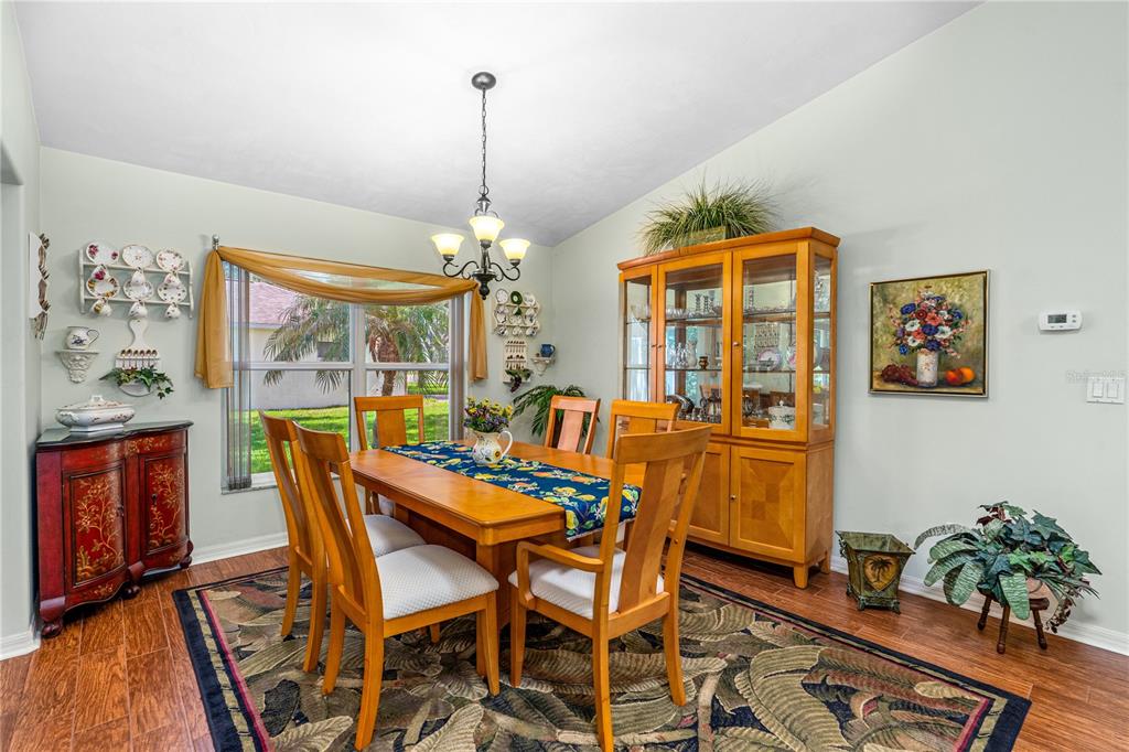 993 Appleview Way Port Orange, FL 32127 - Photo 14 of 46 a view of a dining room with furniture window and wooden floor