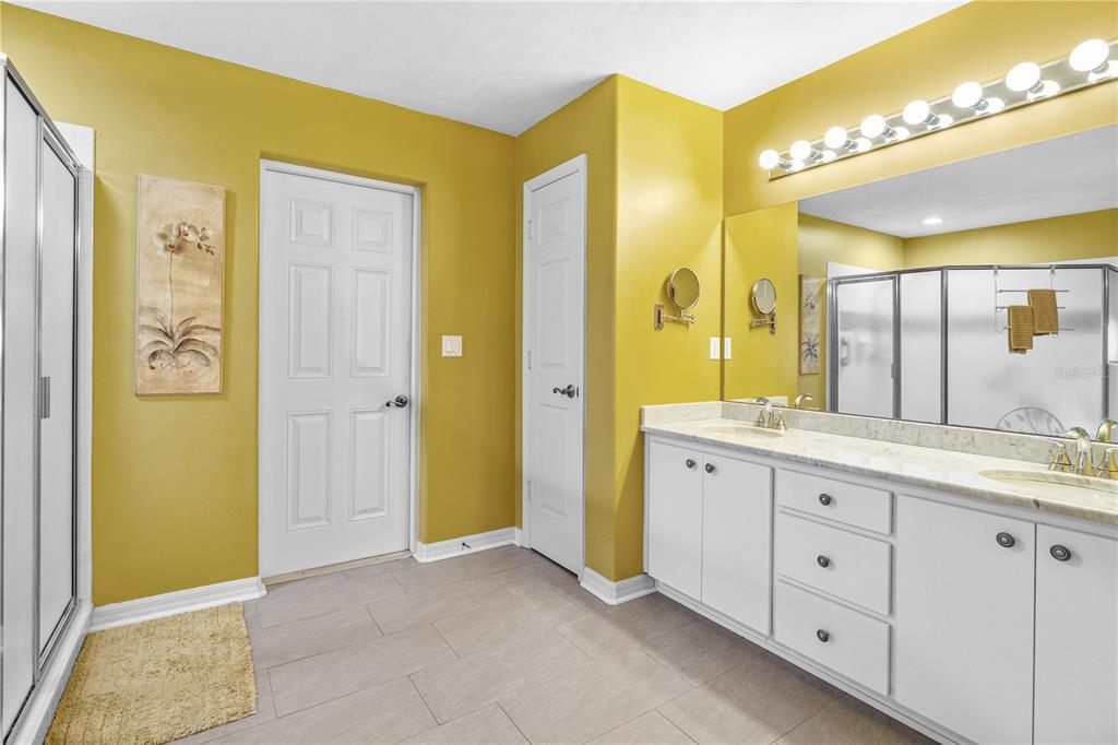 993 Appleview Way Port Orange, FL 32127 - Photo 20 of 46 a spacious bathroom with a granite countertop sink mirror and shower