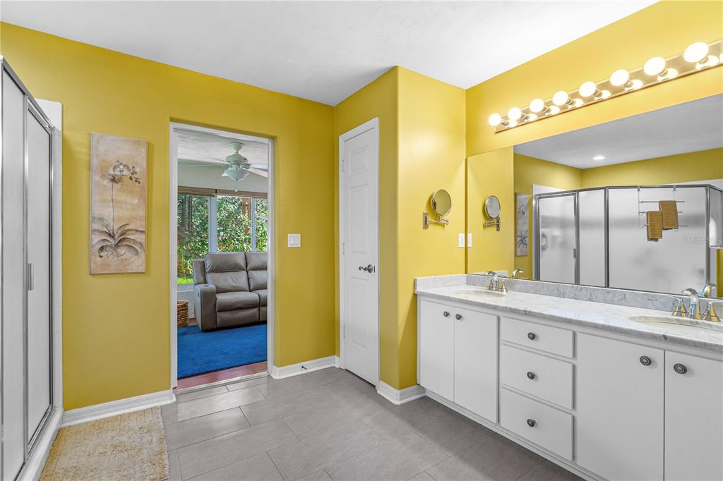 993 Appleview Way Port Orange, FL 32127 - Photo 21 of 46 a spacious bathroom with a granite countertop sink and a mirror