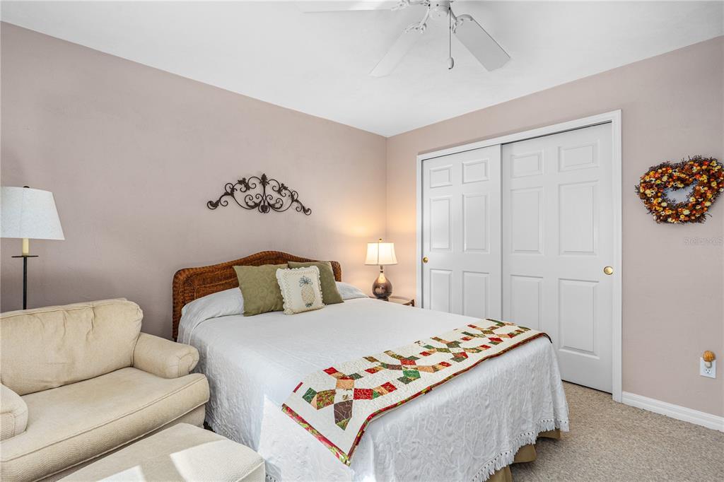 993 Appleview Way Port Orange, FL 32127 - Photo 25 of 46 a bedroom with a bed and a couch