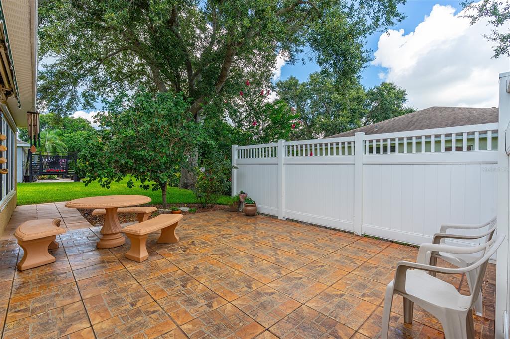 993 Appleview Way Port Orange, FL 32127 - Photo 34 of 46 a view of a patio with a table and chairs