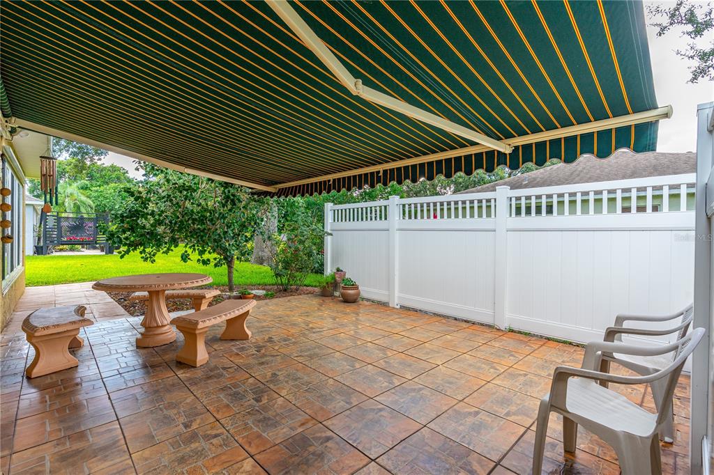 993 Appleview Way Port Orange, FL 32127 - Photo 35 of 46 a roof deck with table and chairs and potted plants