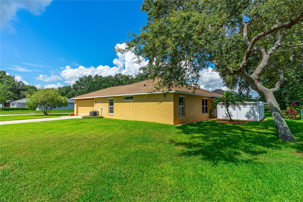 993 Appleview Way Port Orange, FL 32127 - Photo 37 of 46 a yellow house in middle of the grass