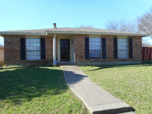 9804 Sophora Circle Dallas, TX 75249 - Photo 1 of 12 front view of a house with a yard