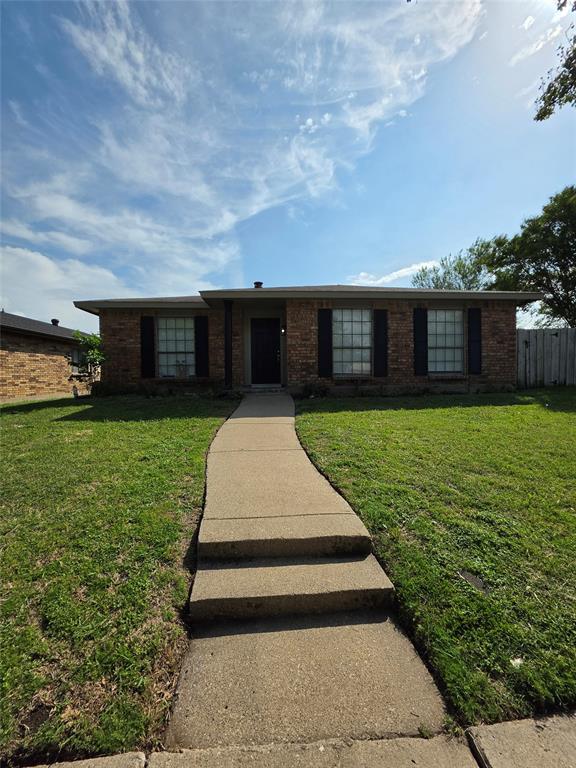9804 Sophora Circle Dallas, TX 75249 - Photo 12 of 12 a front view of a house with garden