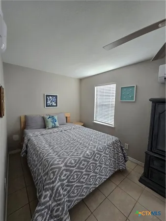 a bathroom with a toilet and a mirror