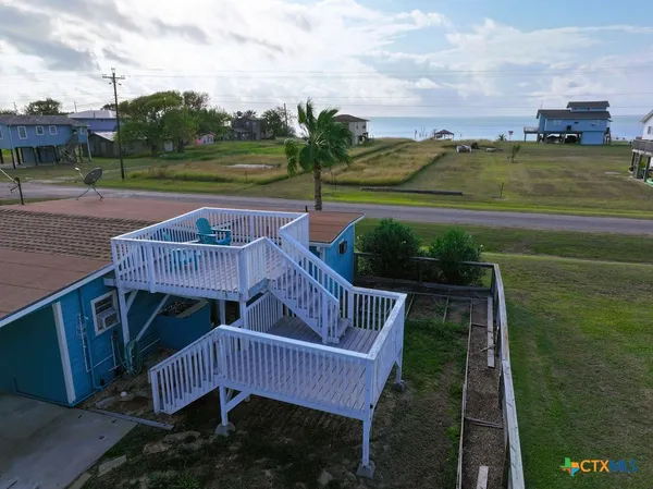 a view of a chairs and tables in the patio