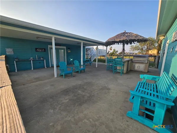 a view of pool table and chairs