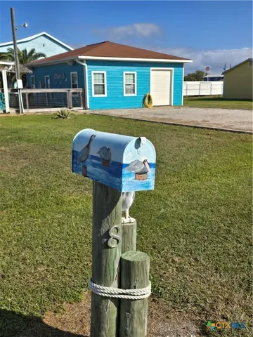 a view of a chairs and table in the patio