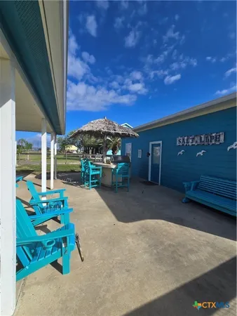 a swimming pool with outdoor seating