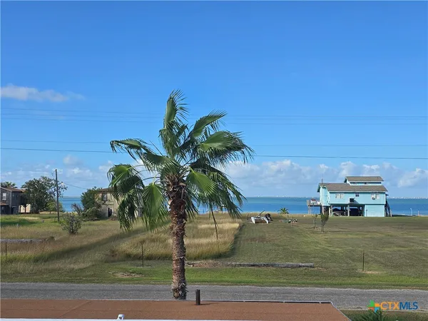 a view of a swimming pool and lounge chair