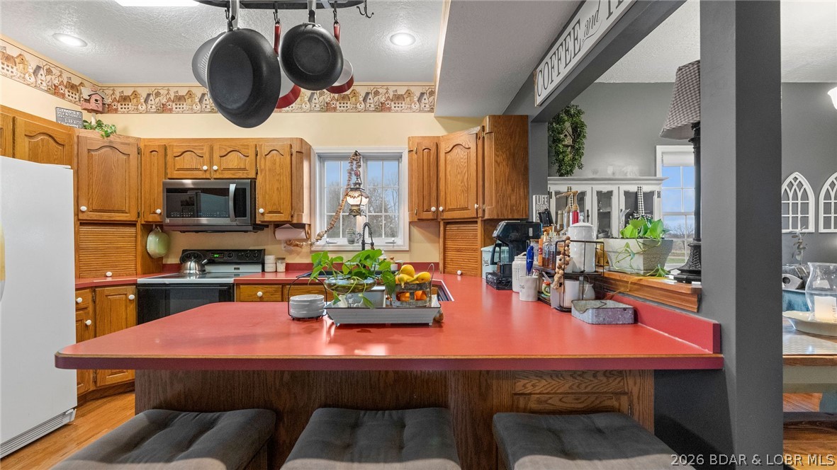 46 County Rd MM-10 Eugene, MO 65032 - Photo 12 of 92 Kitchen breakfast bar