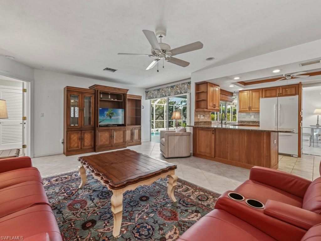1081 Ruppert Road Marco Island, FL 34145 - Photo 14 of 39 a living room with furniture ceiling fan and a rug