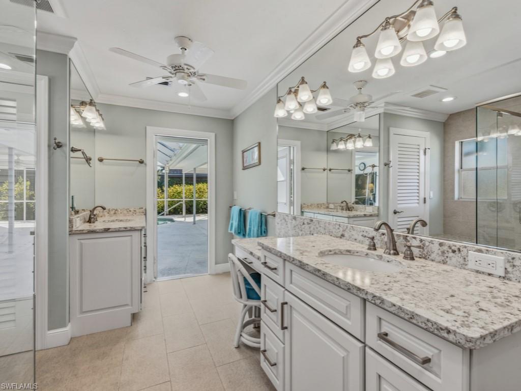 1081 Ruppert Road Marco Island, FL 34145 - Photo 20 of 39 a bathroom with a sink double vanity and a mirror