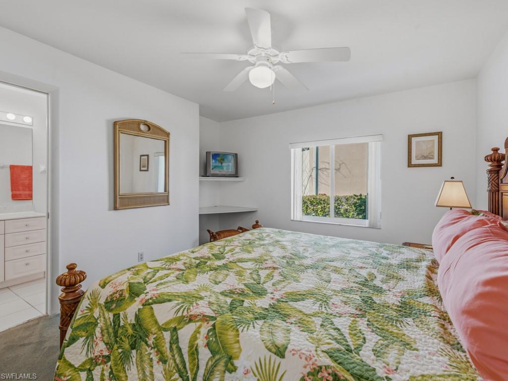 1081 Ruppert Road Marco Island, FL 34145 - Photo 24 of 39 a bedroom with a bed and a painting on the wall