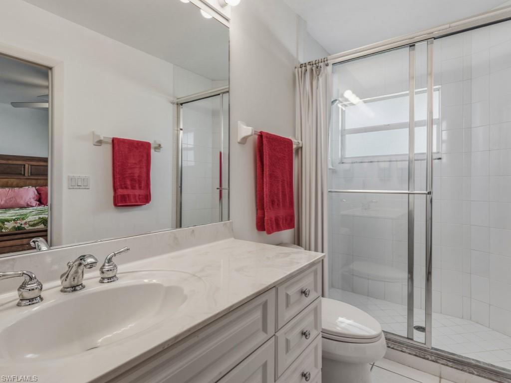 1081 Ruppert Road Marco Island, FL 34145 - Photo 25 of 39 a bathroom with a granite countertop sink toilet and shower