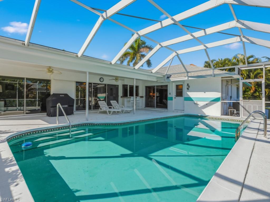 1081 Ruppert Road Marco Island, FL 34145 - Photo 3 of 39 a view of a swimming pool with a patio