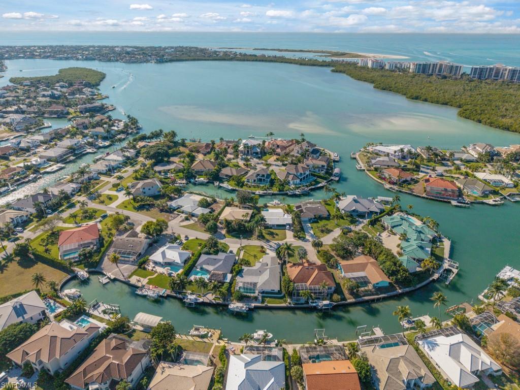1081 Ruppert Road Marco Island, FL 34145 - Photo 32 of 39 an aerial view of lake residential house with outdoor space and trees around
