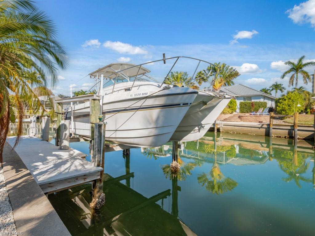 1081 Ruppert Road Marco Island, FL 34145 - Photo 35 of 39 a view of an chairs and table in the patio