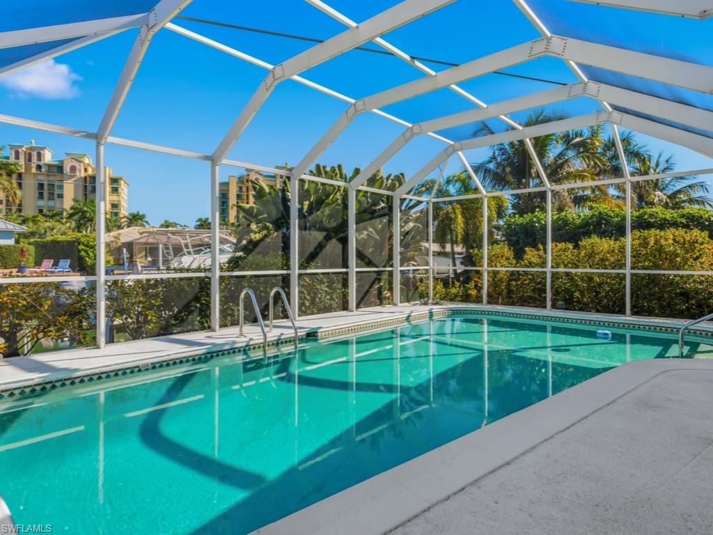 1081 Ruppert Road Marco Island, FL 34145 - Photo 36 of 39 a view of a backyard with wooden floor and door