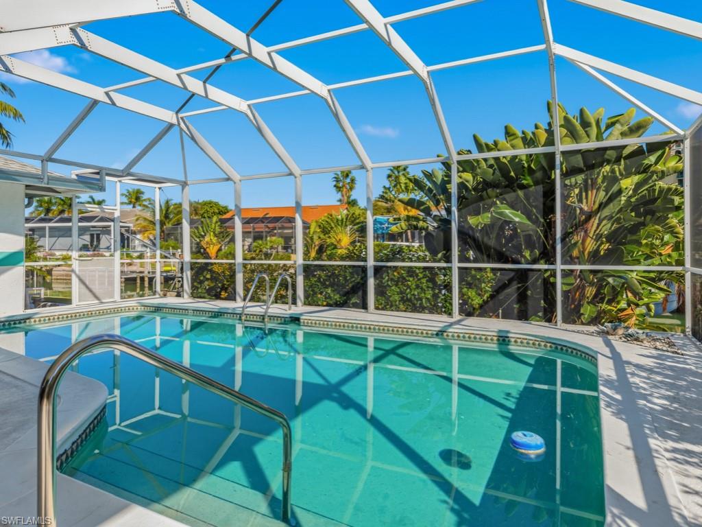 1081 Ruppert Road Marco Island, FL 34145 - Photo 38 of 39 a view of a chair and table on the deck
