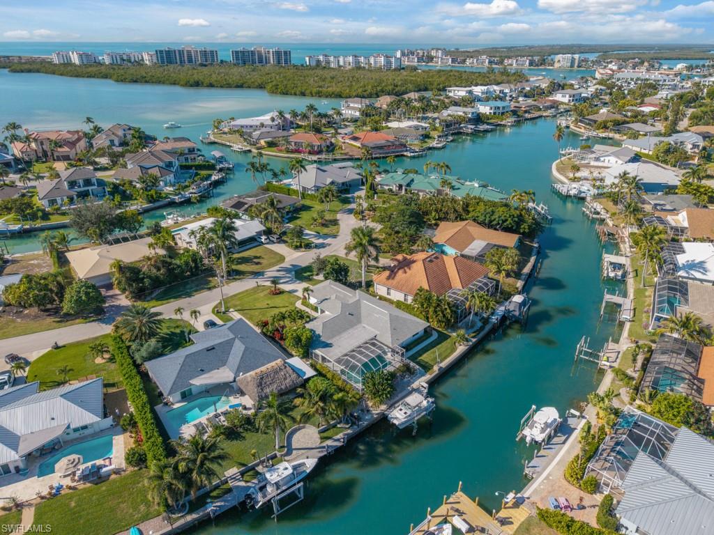 1081 Ruppert Road Marco Island, FL 34145 - Photo 4 of 39 an aerial view of residential houses with outdoor space and lake view