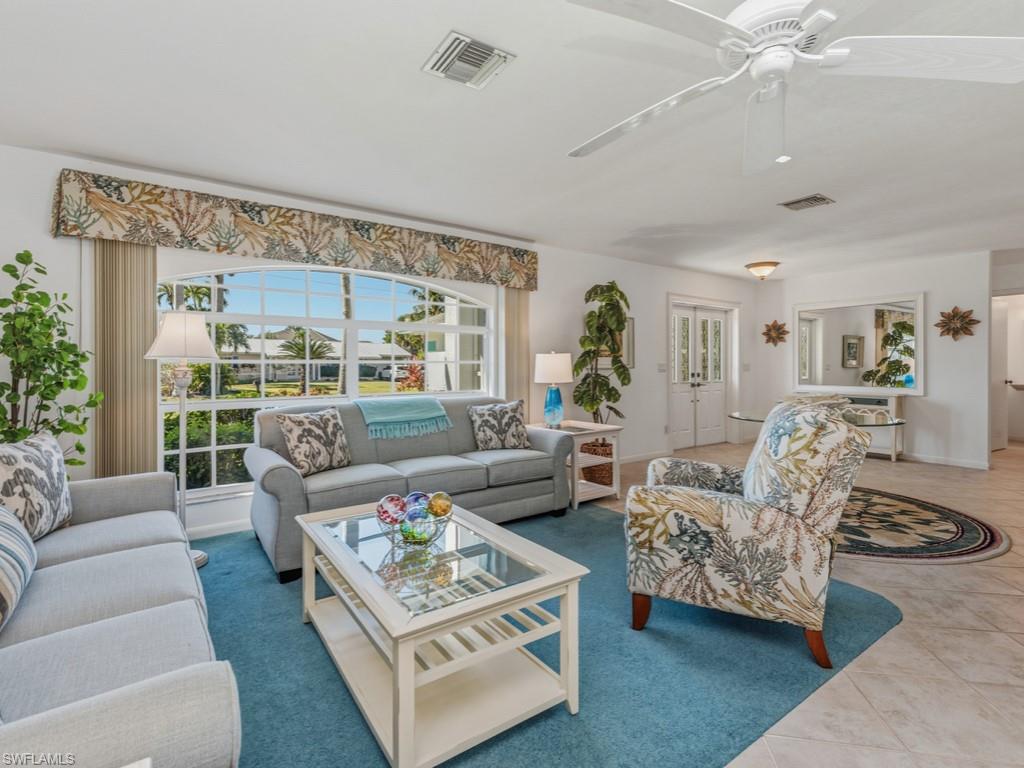 1081 Ruppert Road Marco Island, FL 34145 - Photo 7 of 39 a living room with furniture and a large window