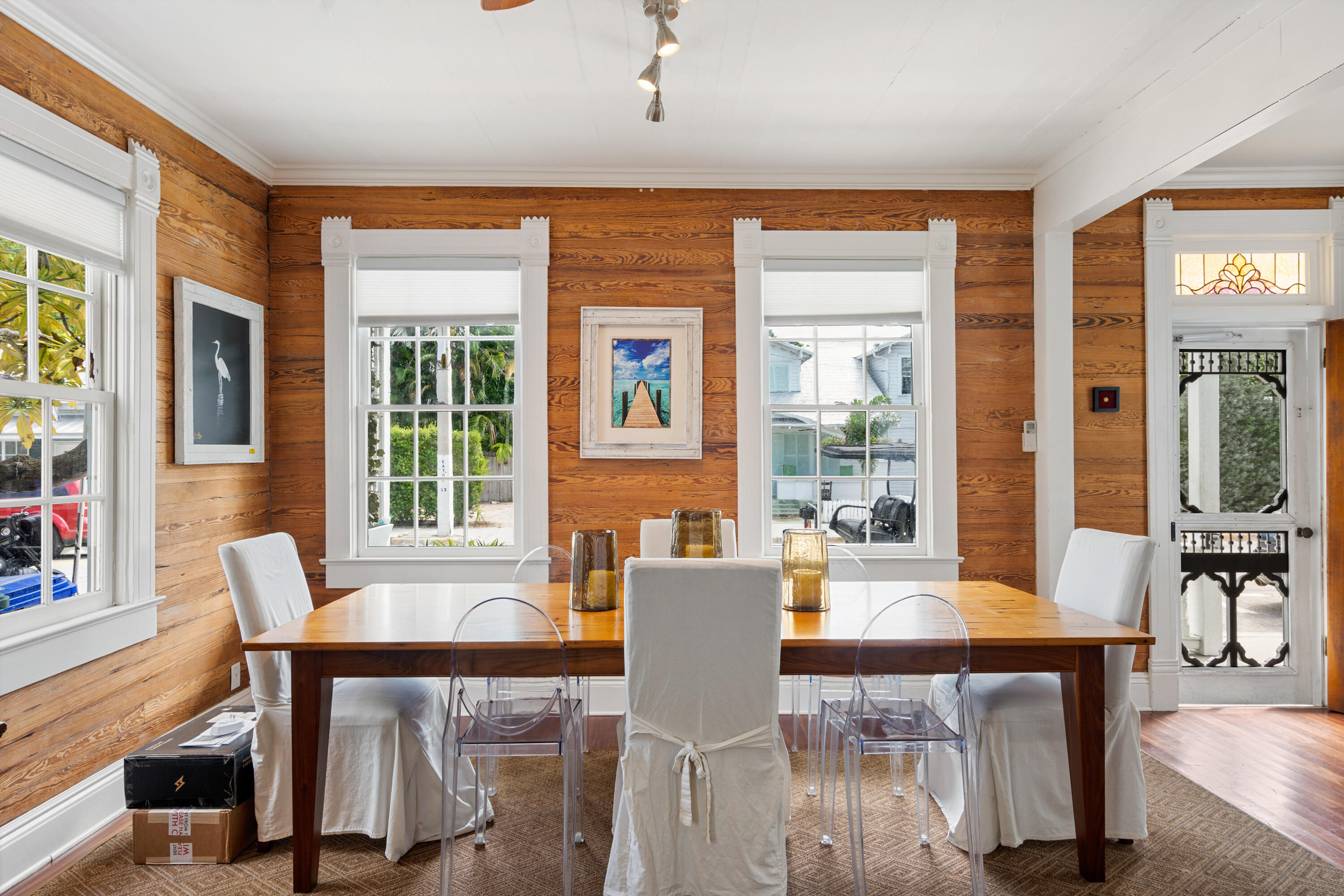 923 Eaton Street Key West, FL 33040 - Photo 13 of 42 a view of a dining room with furniture window and wooden floor