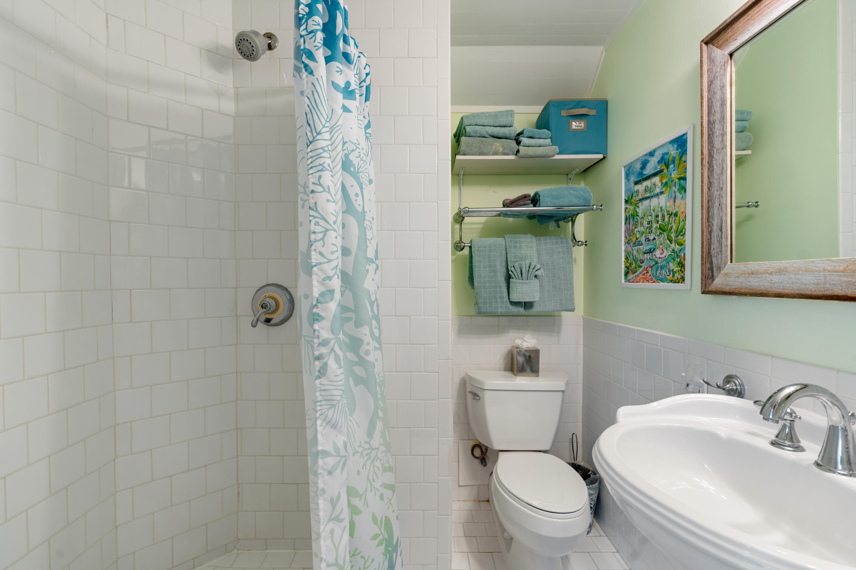 923 Eaton Street Key West, FL 33040 - Photo 22 of 42 a bathroom with a toilet sink and mirror