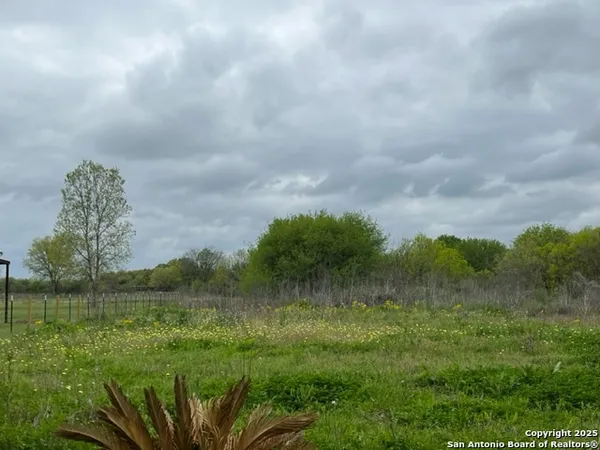 a view of a lake with a big yard