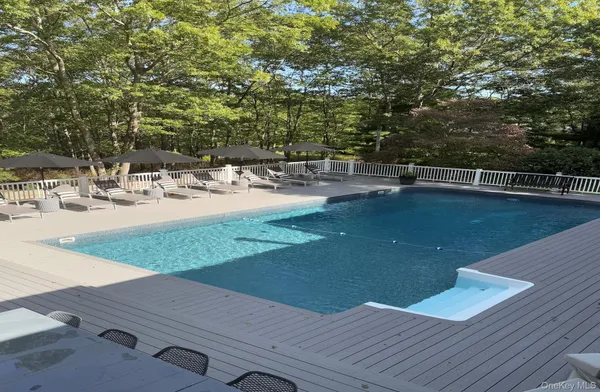 a view of a swimming pool with a patio