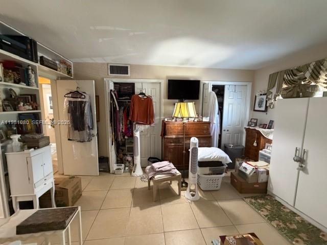 7403 Southwest 82nd Street, Unit 212N Miami, FL 33143 - Photo 7 of 10 a living room with furniture and a flat screen tv