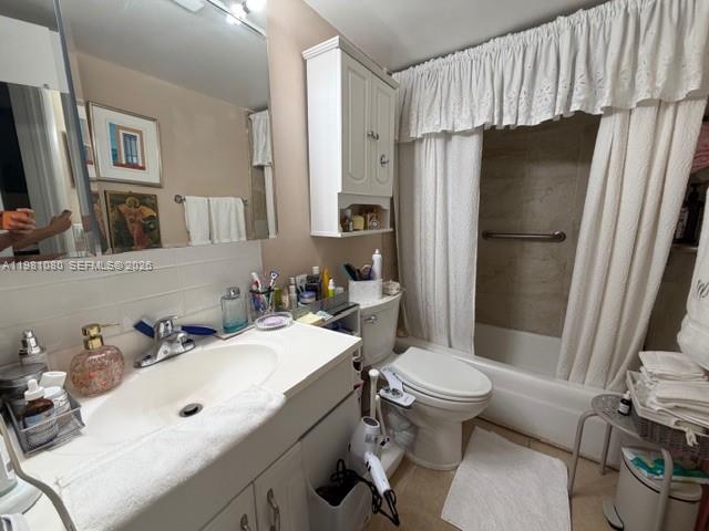 7403 Southwest 82nd Street, Unit 212N Miami, FL 33143 - Photo 9 of 10 a bathroom with a sink toilet and shower