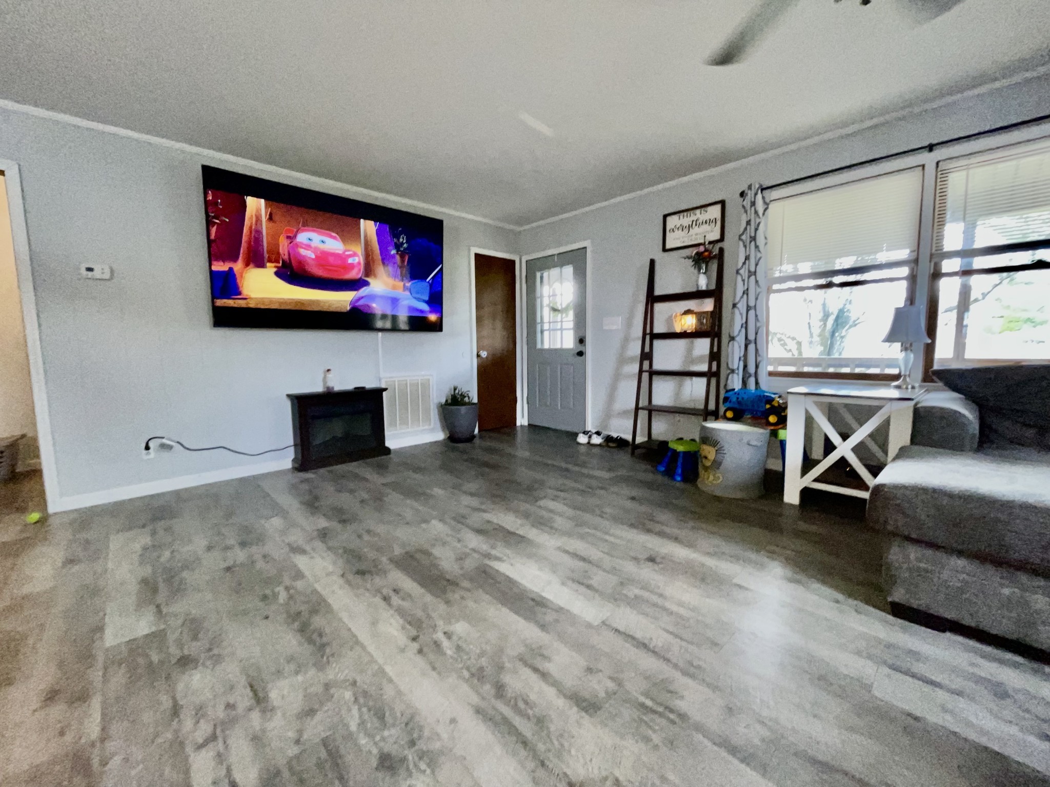 219 John Fuson Road Smithville, TN 37166 - Photo 14 of 84 a living room with furniture and a flat screen tv