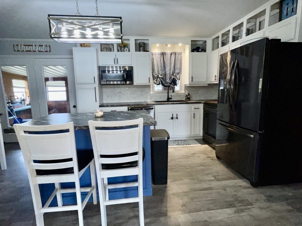 219 John Fuson Road Smithville, TN 37166 - Photo 16 of 84 a kitchen with stainless steel appliances a refrigerator sink and stove