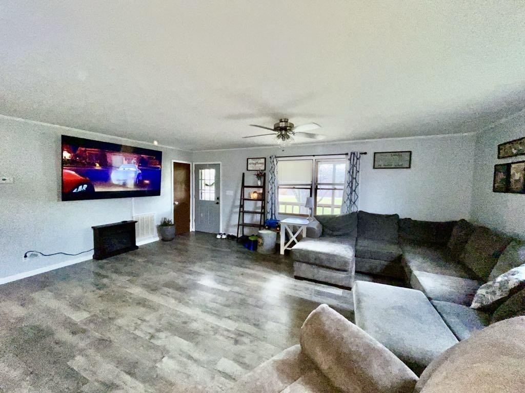 219 John Fuson Road Smithville, TN 37166 - Photo 26 of 84 a living room with furniture and a flat screen tv