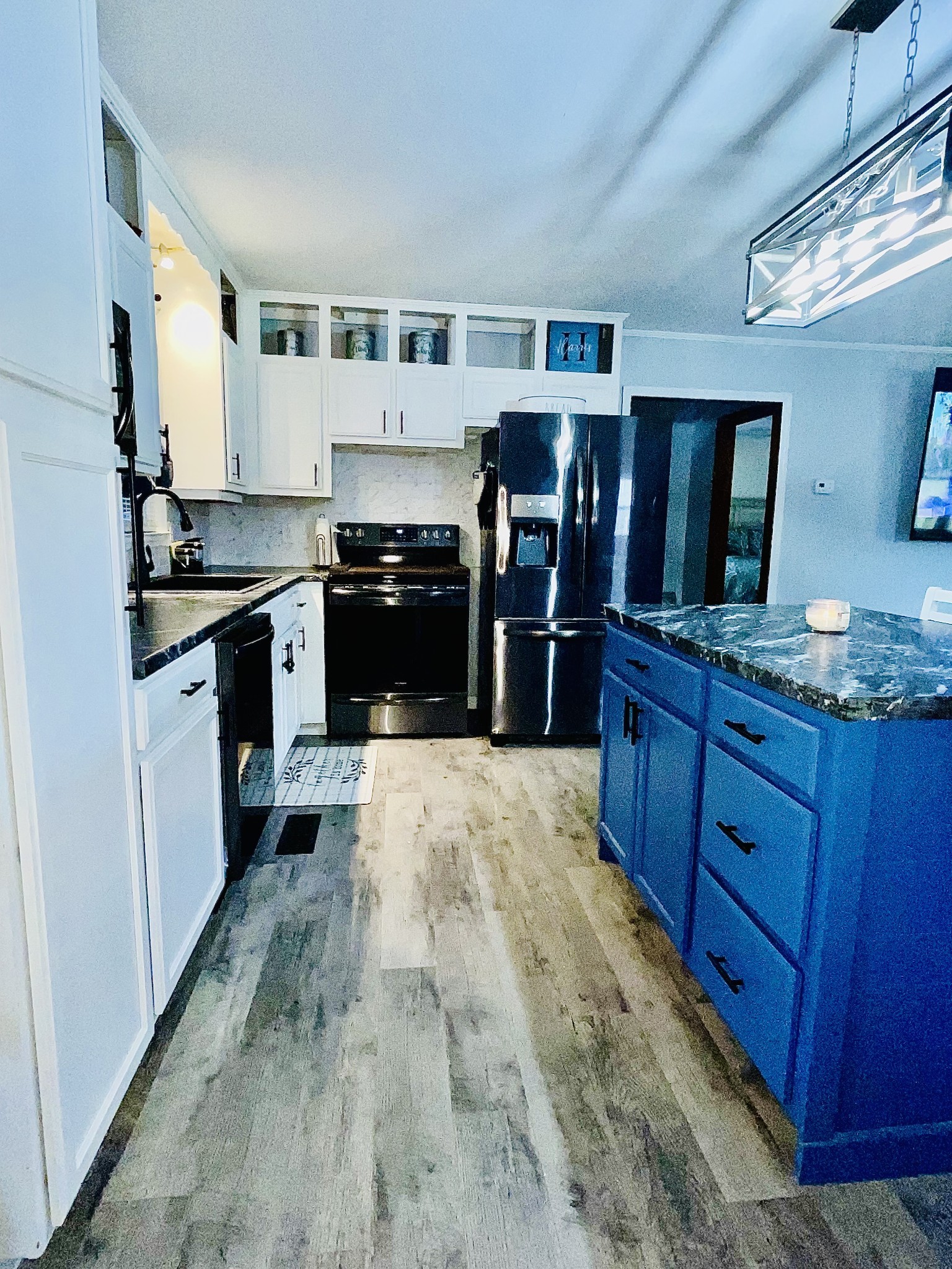 219 John Fuson Road Smithville, TN 37166 - Photo 27 of 84 a kitchen with granite countertop a refrigerator stove top oven and sink