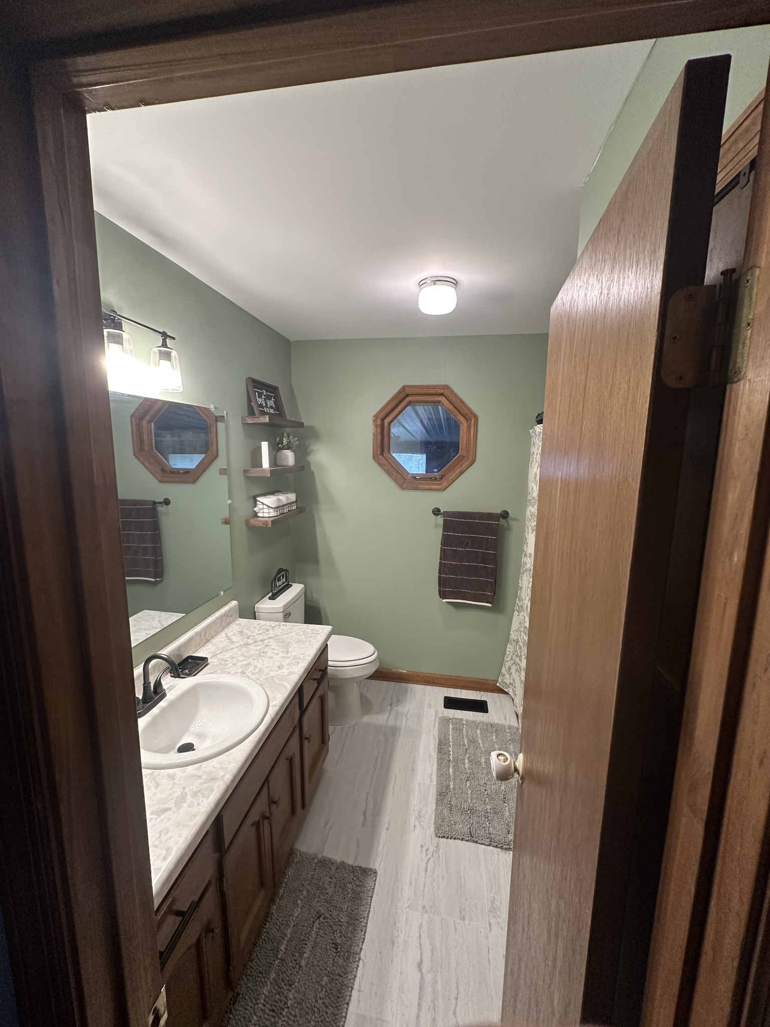 219 John Fuson Road Smithville, TN 37166 - Photo 37 of 84 a spacious bathroom with a double vanity sink and a mirror