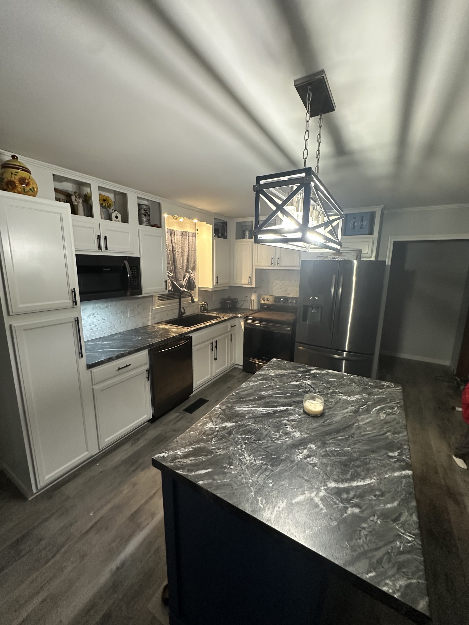 219 John Fuson Road Smithville, TN 37166 - Photo 38 of 84 a kitchen with stainless steel appliances granite countertop a sink stove and refrigerator